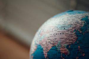 A partial view of a globe on top of a desk